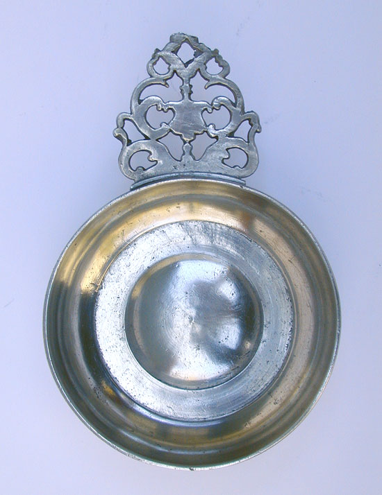 A Pewter Flower Handle Porringer with a Most Unusual Foot
