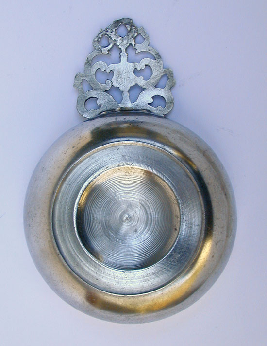 A Pewter Flower Handle Porringer with a Most Unusual Foot