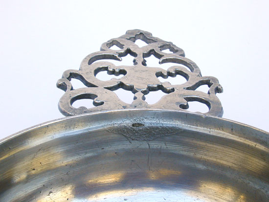 A Pewter Flower Handle Porringer with a Most Unusual Foot