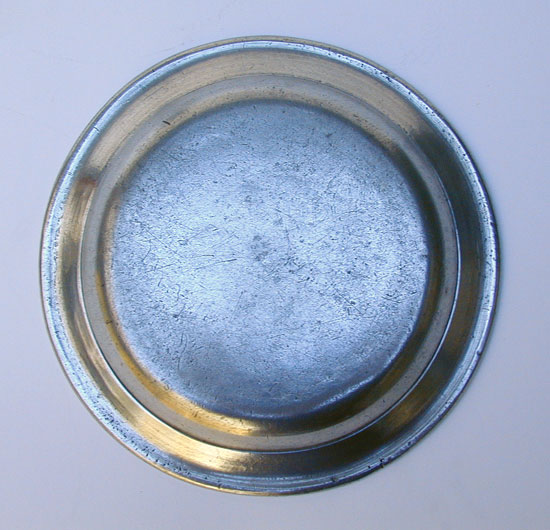 A Small Size Unmarked American Pewter Butter Plate