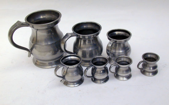 An Assembled Set of Enlish Pewter Bellied Pub Measures