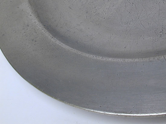 A Scarce Flat-Rim Plate by Cornelius Bradford