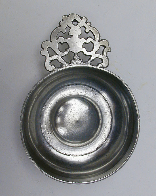 An Unmarked Petite Rhode Island Flower Handle Porringer