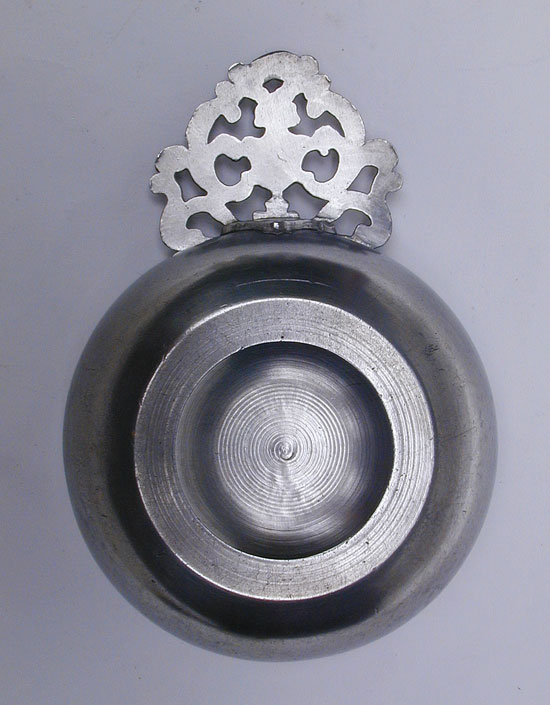 An Unmarked Petite Rhode Island Flower Handle Porringer