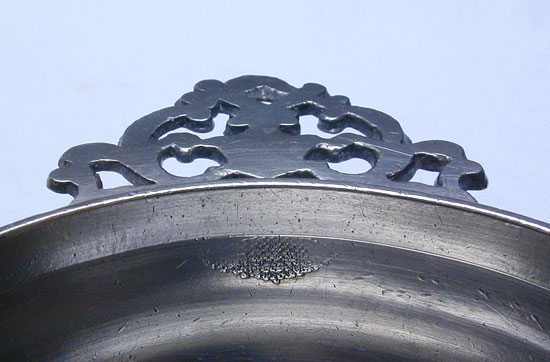 An Unmarked Petite Rhode Island Flower Handle Porringer