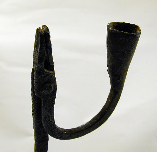 A Wrought Iron Rush and Candle Holder