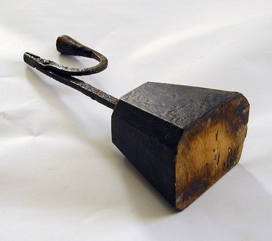 A Wrought Iron Rush and Candle Holder