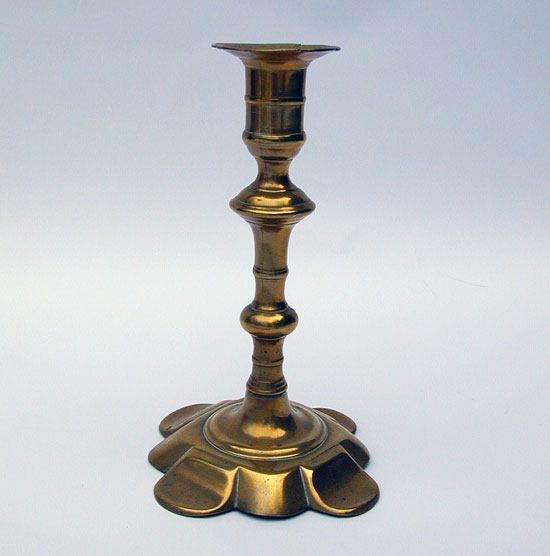 A Queen Anne Petal Base Brass Candlestick