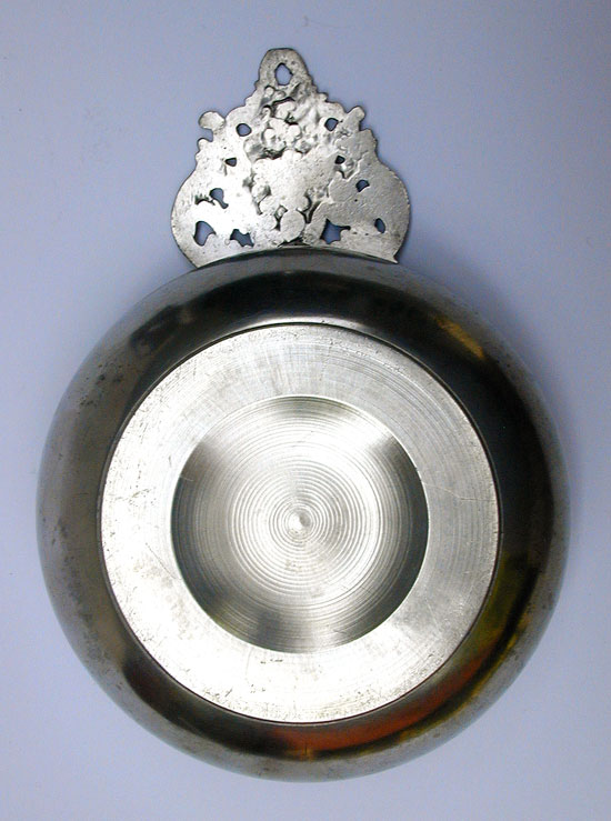 A Wide Bellied Crown Handle Porringer