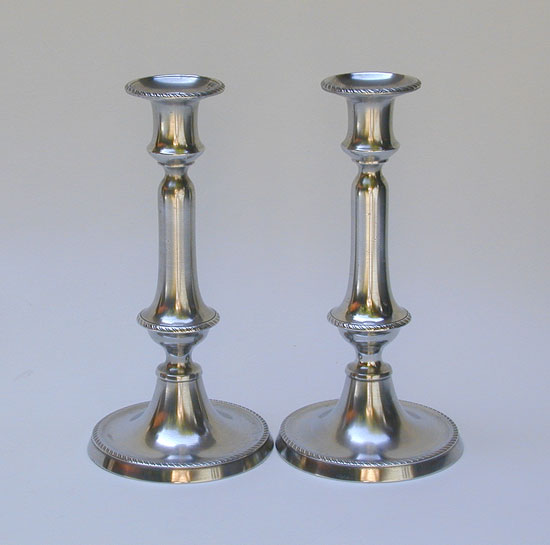 A Pair of Rope Border Decorated English Push-Up Candlesticks