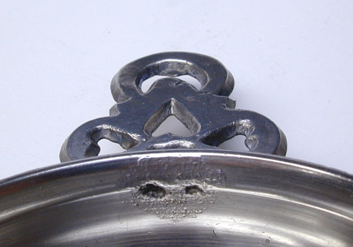 A Pewter Porringer with Heart and Crescent Moon Handle