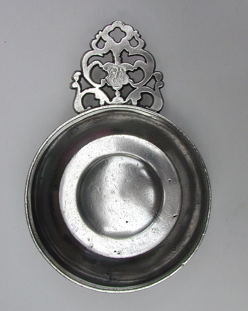 A Pewter Flower Handle Porringer by Samuel E. Hamlin