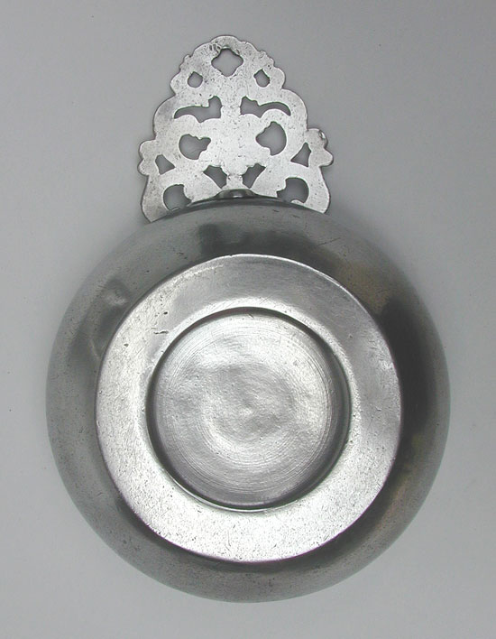 A Pewter Flower Handle Porringer by Samuel E. Hamlin