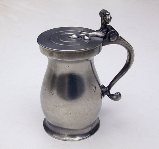 A Half-Pint Double Volute Baluster Pewter Measure