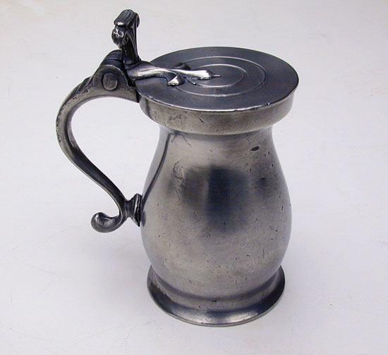 A Half-Pint Double Volute Baluster Pewter Measure